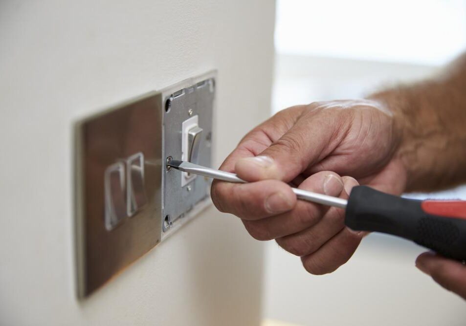 Close,Up,Of,Electrician,Repairing,Domestic,Light,Switch